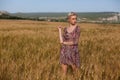 A woman farmer in a field of ripe wheat harvest Royalty Free Stock Photo