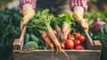 Woman farmer holding box with colorful vegetables in her hands close-up