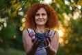 Woman farmer holding grapes at sunset Royalty Free Stock Photo