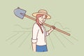 Woman farmer holding shovel to prepare land for planting seeds or digging up crop