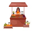 Woman farmer sells vegetables and fruits on the counter on the market