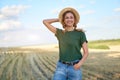 Woman farmer straw hat standing farmland smiling Female agronomist specialist farming agribusiness Happy positive caucasian worker