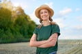 Woman farmer straw hat standing farmland smiling Female agronomist specialist farming agribusiness Happy positive caucasian worker