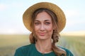 Woman farmer straw hat standing farmland smiling Female agronomist specialist farming agribusiness Happy positive caucasian worker