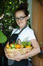 woman farmer with vegetable harvest. organic food and eco farming. greengrocer woman outdoor. harvester or gardener. summer Royalty Free Stock Photo