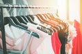 Woman fashion clothes of different colors clothing on hangers at the showroom - Hanging clothes closet rack Royalty Free Stock Photo