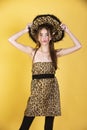 Woman fashion concept. Girl in leopard clothes. Trendy girl with animal print dress.