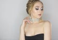 Woman with fashion hairstyle and make up. Trendy black lacy choker with cristals