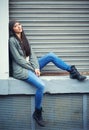 Woman, fashion and jeans with portrait, urban and city street or background for style. Female student, beanie and jacket