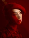 Woman, fashion and makeup with red aesthetic, beauty and art deco with vintage hat isolated on studio background. Retro