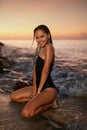 Woman Fashion And Summer Style. Girl In Black Swimsuit In Sea Royalty Free Stock Photo