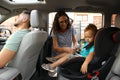 Woman fastening her son with car safety belt Royalty Free Stock Photo