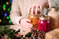 Woman Fastening Lids On Homemade Jars Of Preserved Fruit For Eco Friendly Christmas Gift Royalty Free Stock Photo