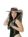 Woman in feathered hat with dagger and corset Royalty Free Stock Photo