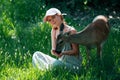 Woman feed fawn deer. Unity with nature. Wild animals concept. Girl feeding bambi. Animal at park. Royalty Free Stock Photo