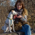Woman feeding dog Royalty Free Stock Photo