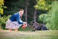 Woman feeding dog Royalty Free Stock Photo