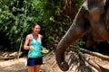 Woman feeding an elephant