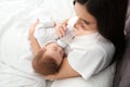 Woman feeding her baby from bottle Royalty Free Stock Photo