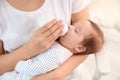 Woman feeding her baby from bottle at home Royalty Free Stock Photo