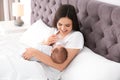 Woman feeding her baby from bottle Royalty Free Stock Photo