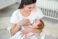 Woman feeding her baby from bottle Royalty Free Stock Photo