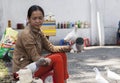 Woman feeding pigeons