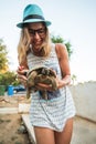 Woman feeding turtle