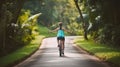 Woman feel free cycling on tropical park trail in summer, Generative AI