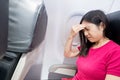 Woman feel headache in airplane Royalty Free Stock Photo