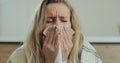 Woman feel sick blow running nose suffer from cold or influenza. Young female distressed with health problems, struggle