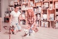 Woman feeling excited before buying special clothing for pets