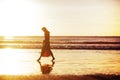 Woman feeling free meeting sun near the sea Royalty Free Stock Photo