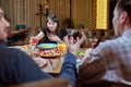 Woman Feeling Sick While Eating Bad Food in a Restaurant. Dinner customer having a bad experience feeling sick Royalty Free Stock Photo