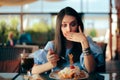 Woman Feeling Sick While Eating Huge Meal Royalty Free Stock Photo