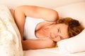 Woman feeling sick with stomachache in bed - Pain in stomach Royalty Free Stock Photo