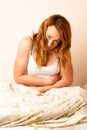 Woman feeling sick with stomachache in bed - Pain in stomach Royalty Free Stock Photo