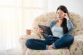 Woman feeling tired while reading on tablet Royalty Free Stock Photo