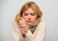 Woman feels badly ill sneezing. Girl in scarf hold thermometer and tissue close up. Measure temperature. High