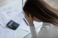 Woman feels desperate after calculating expenses having financial problems Royalty Free Stock Photo