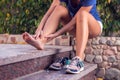 Woman feels strong foot pain while doing exercises. People, healthcare and medicine concept