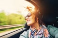 Woman feels free and looks out from open window car Royalty Free Stock Photo