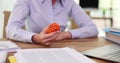 Woman feels stress and nervousness holds an antistress ball in hand