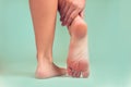 Woman feels strong foot pain . People, healthcare and medicine concept