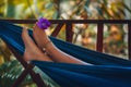 Woman feet close up lying in hammock