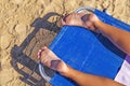 Woman feet closeup of girl relaxing on beach on sunbed enjoying Royalty Free Stock Photo