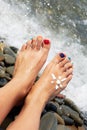 Woman feet closeup of girl relaxing on beach on sunbed enjoying Royalty Free Stock Photo