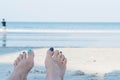 Woman feet closeup of girl relaxing on beach Royalty Free Stock Photo