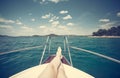 Woman feet closeup, sea in the background - girl relaxing on a yacht Royalty Free Stock Photo