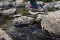 Woman feet hiking in rocky mountains Royalty Free Stock Photo